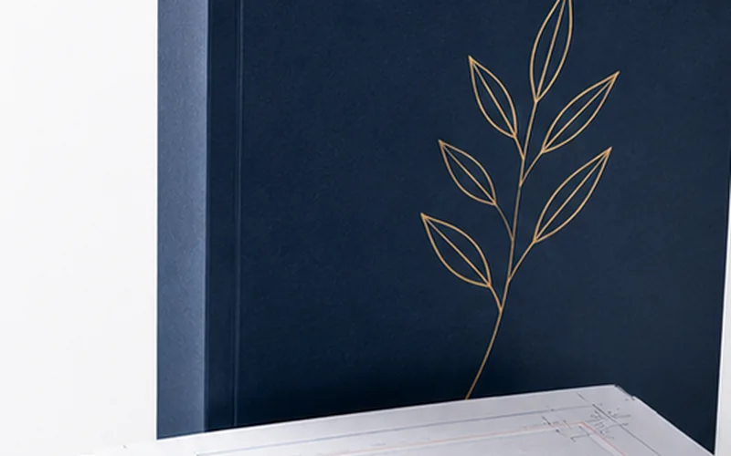 Print preparation workspace with a book cover and production specifications